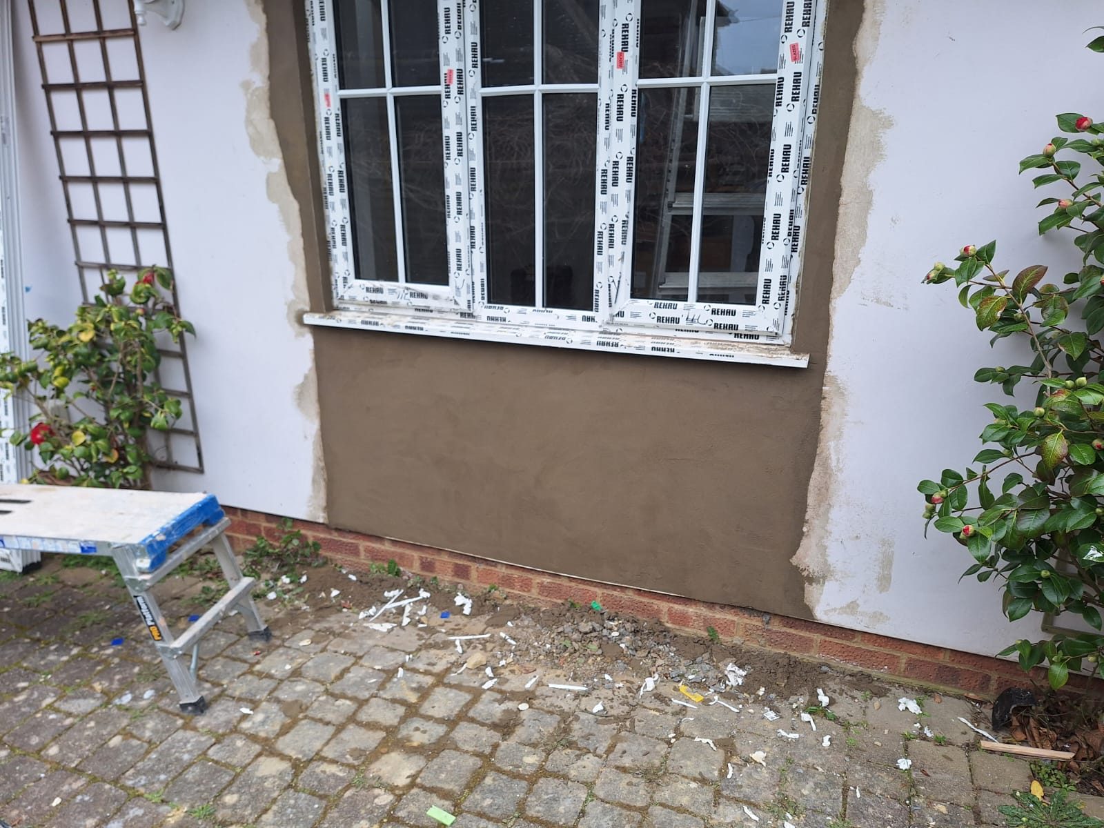 External wall rendered and made good after extension building work
