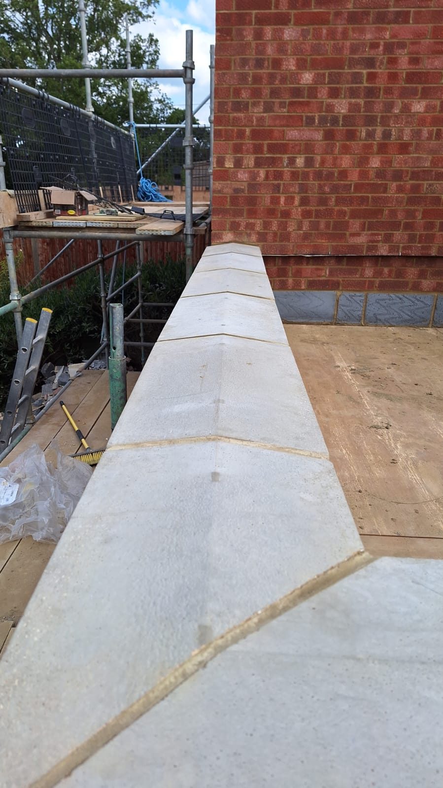 Concrete coping and wall plate set out on a rear house extension build