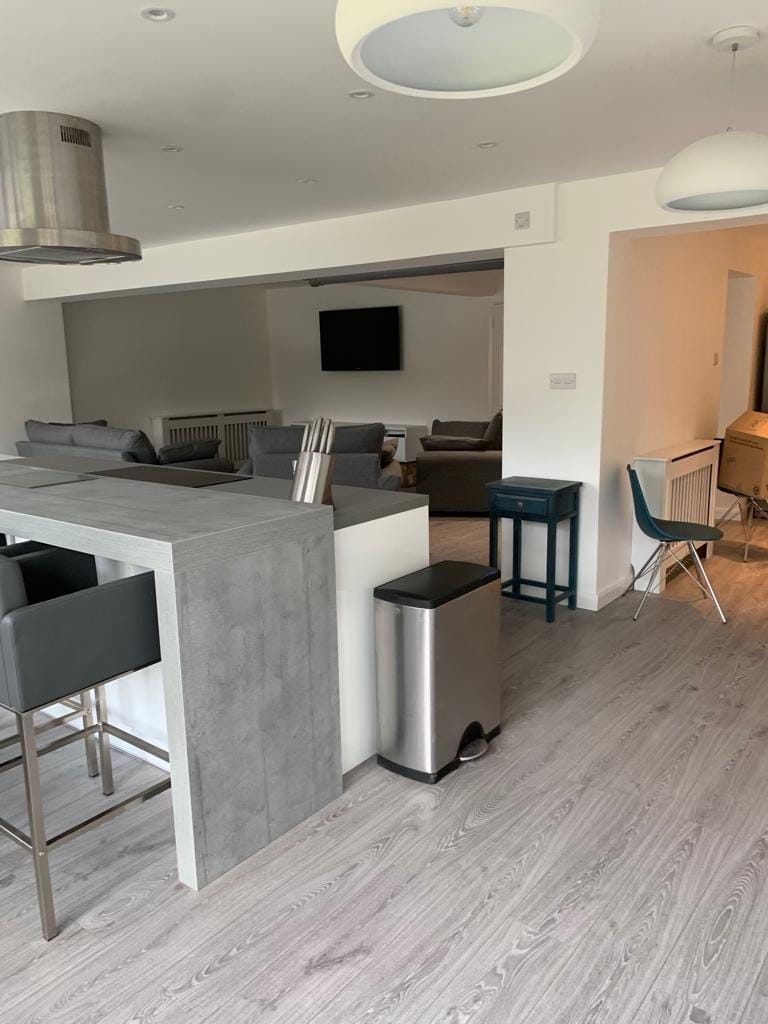 Open-plan kitchen and living space completed in a house refurbishment