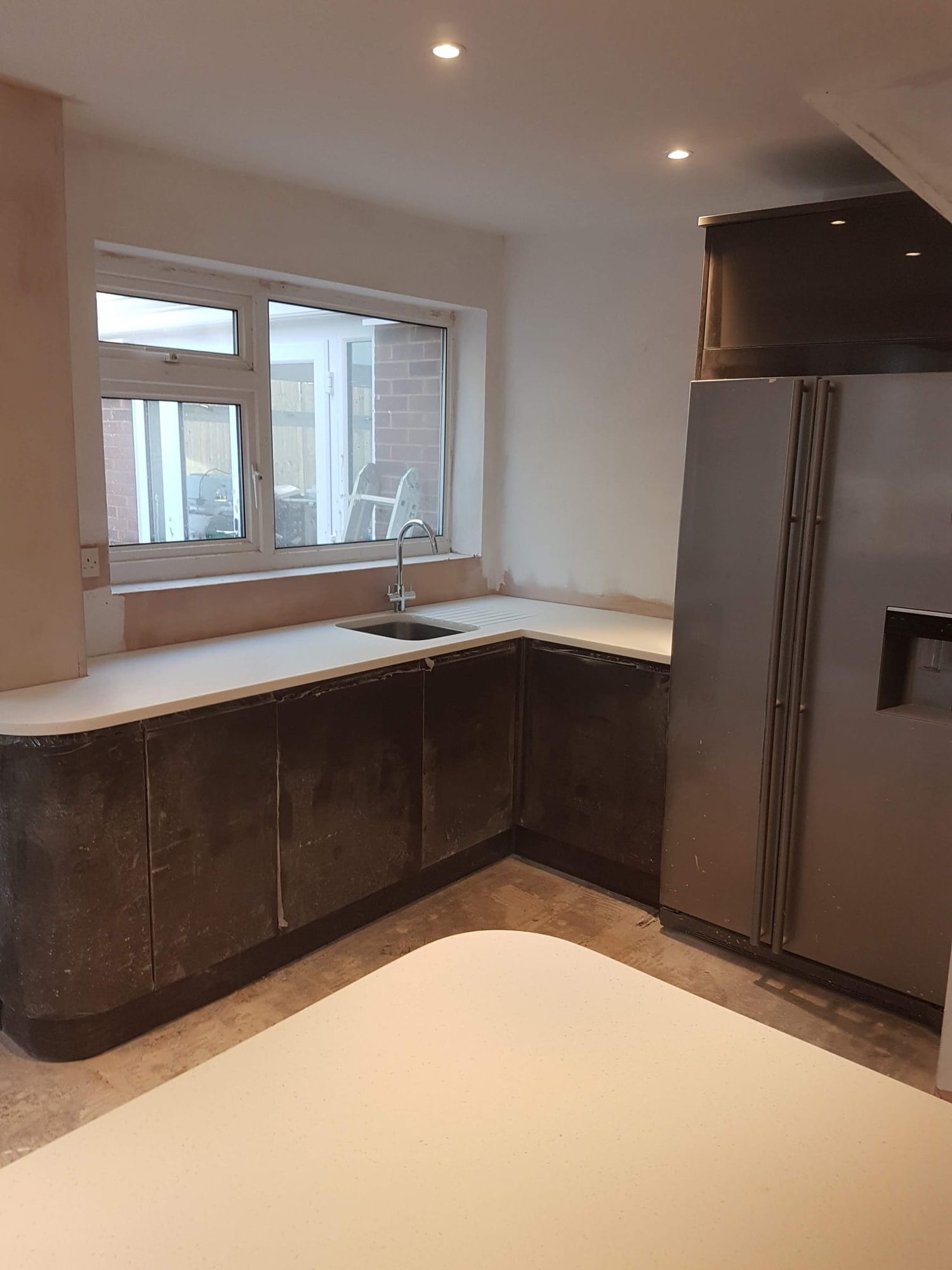 Kitchen worktops and sink fitted during a kitchen refurbishment