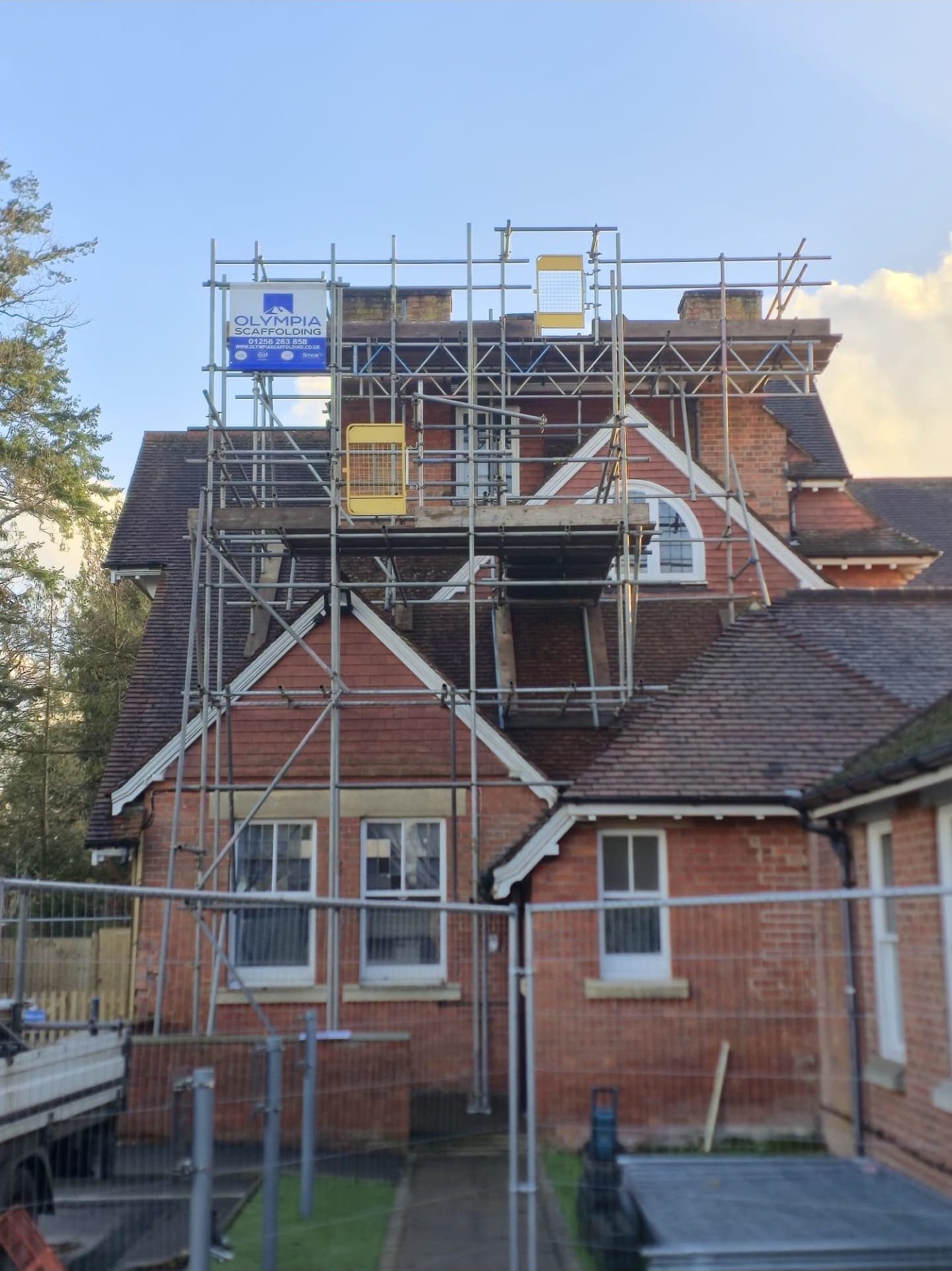 Scaffolding erected around a period house for a loft conversion