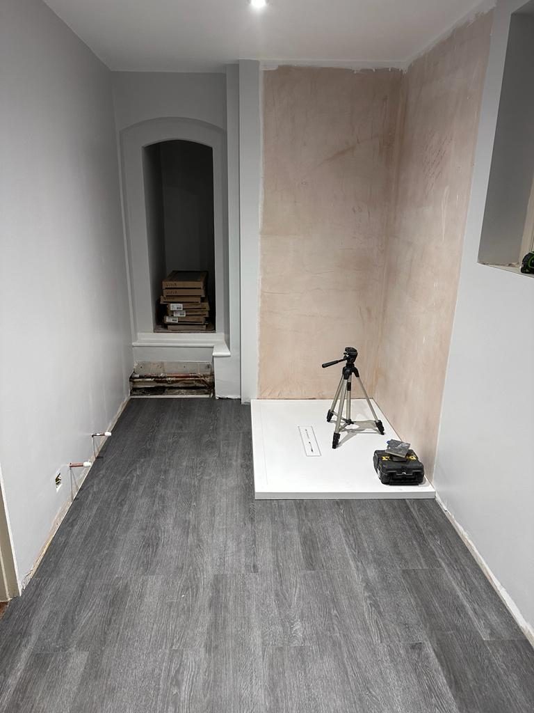 Plastered walls and new flooring in a refurbished ground floor room