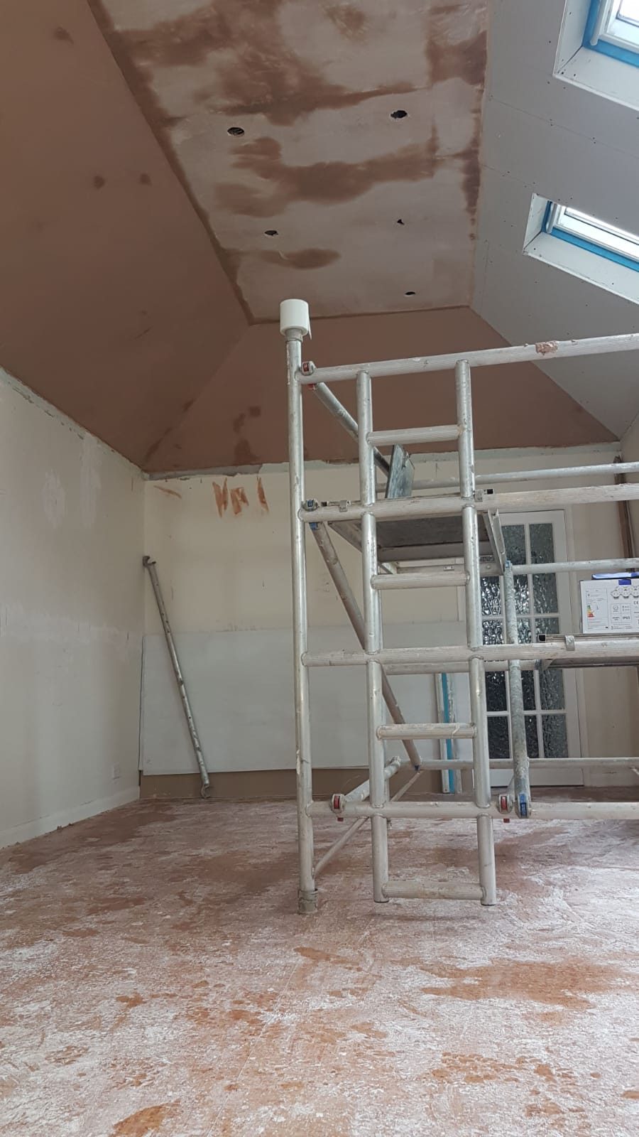 Loft conversion ceiling plastered and ready for decoration