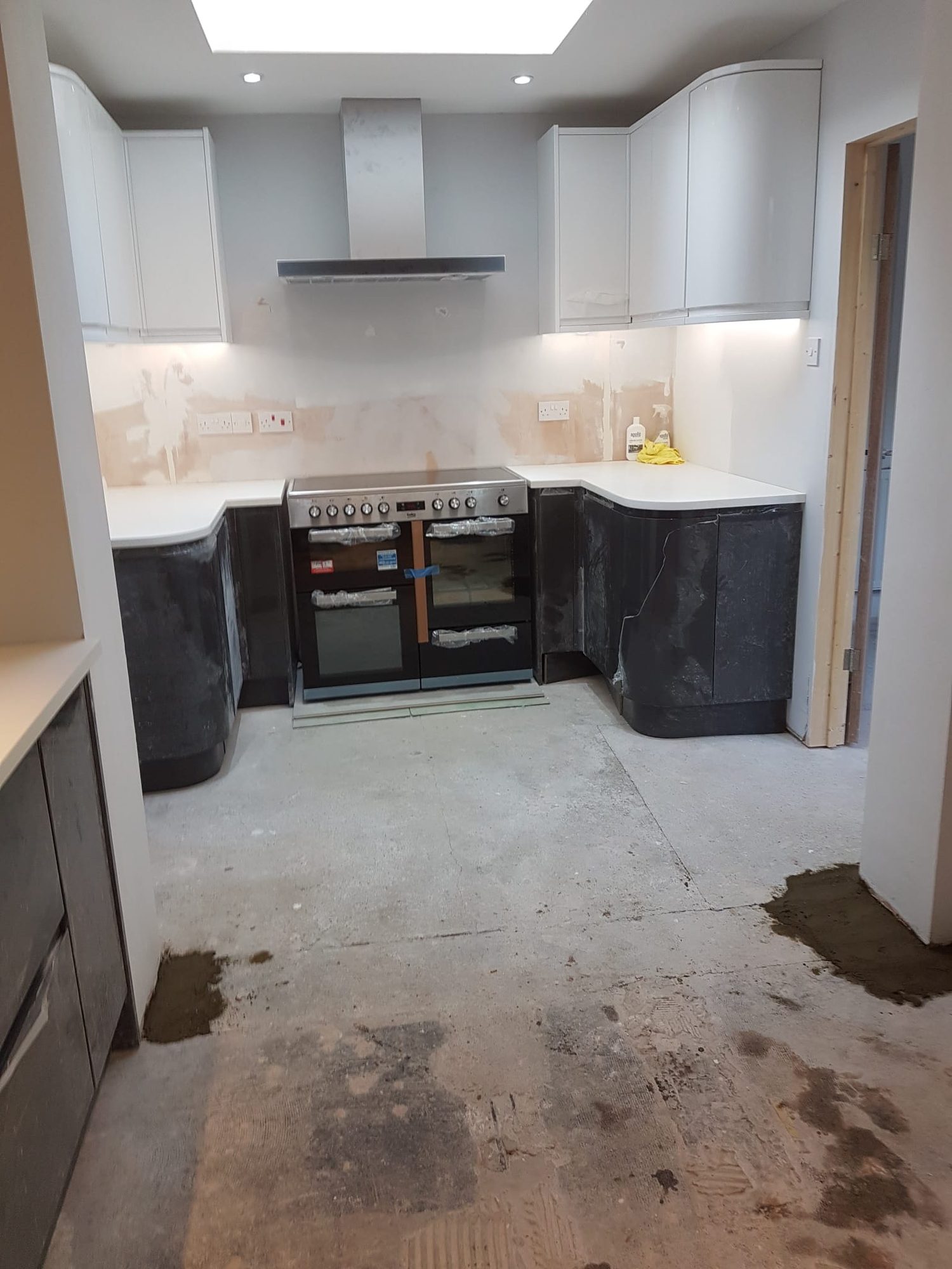 New fitted kitchen and range cooker installed in a house refurbishment